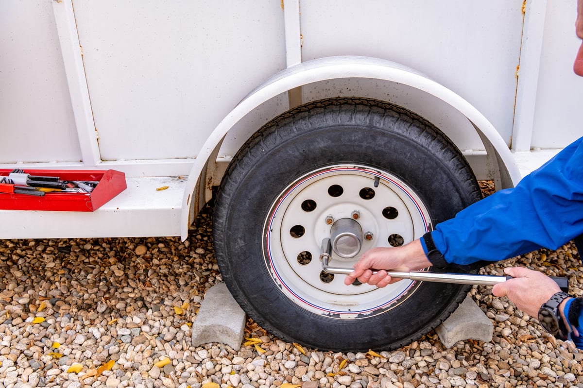Mechanic working on caravan wheel hub