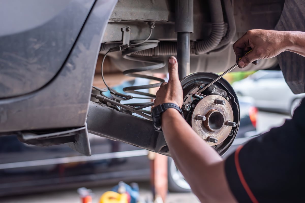 Mechanic working on brake system