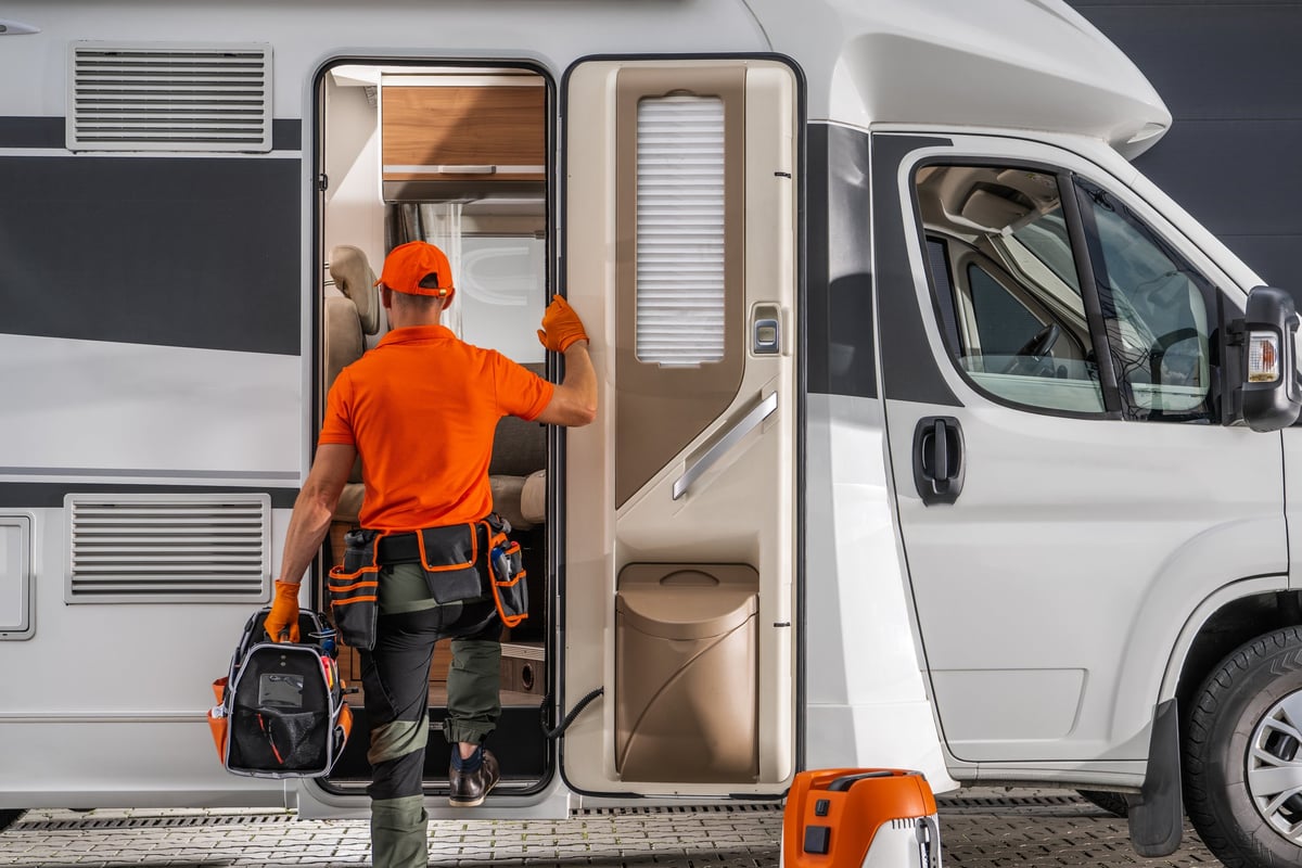 Technician preparing for caravan maintenance